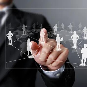 Business professional connecting a network of clients